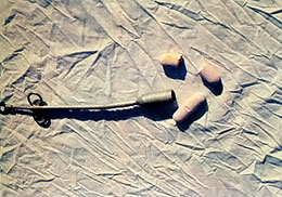 A bolus gun and horse-sized boluses.